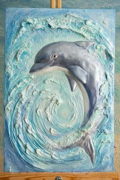 a painting of a dolphin in the ocean