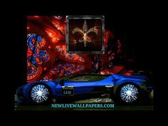 an image of a blue car in front of a red and black background with the words new wallpapers com