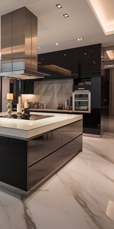 a modern kitchen with marble counter tops and stainless steel appliances, along with black cabinets