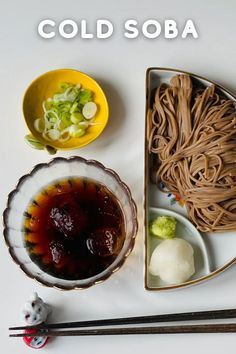 an overhead view of food with chopsticks on the side