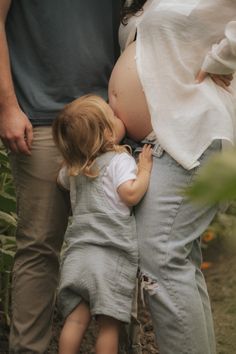 a pregnant woman is holding her child's belly