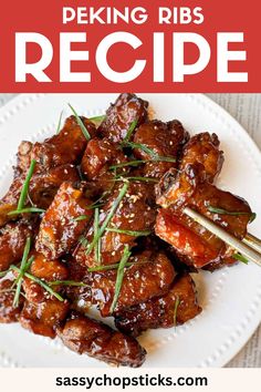 the recipe for peking ribs on a white plate with chopsticks