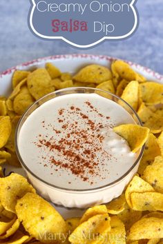 creamy onion salsa dip in a bowl with tortilla chips on the side and text overlay