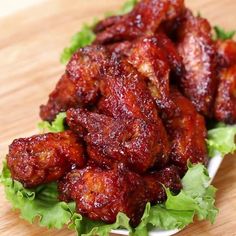 chicken wings with lettuce on a wooden table