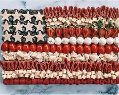 an american flag made out of strawberries and other foods