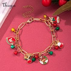 The concept of the "Christmas Red and Green Snowflake Bell Bracelet" caters to individuals who enjoy accessorizing with festive and themed jewelry during the Christmas season. This bracelet is designed to capture the essence of Christmas with its color palette and charming holiday motifs, offering a cheerful and stylish accessory that can be worn to celebrate the joy and spirit of the holiday season.  - Brand: Thaya  - Material: Plastic  - Size: Chain length 9cm+6cm; Pendant 1.9*2.4cm  - Weight: 13g  - Style: Snowflake, Christmas gift box, Elk, New Year, Christmas bell, Santa Claus  - Gender: Unisex Bell Bracelet, Christmas Red And Green, Christmas Series, Pearl Bangle, Festival Jewelry, Bell Pendant, Themed Jewelry