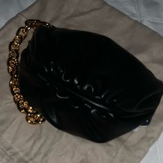 Black Small Night Out Shoulder Leather Bag. Gold Chain Hardware, Big Enough For All Your Essentials Black Clutch With Removable Pouch For Night Out, Black Soft Leather Bag For Night Out, Black Soft Leather Shoulder Bag For Night Out, Black Pouch Clutch As Fashion Accessory, Black Leather Clutch For Night Out, Black Soft Leather Clutch For Evening, Chic Black Soft Leather Clutch, Black Clutch With Chain Strap For Everyday, Everyday Black Clutch With Chain Strap