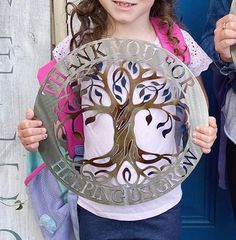 "This sign is the perfect gift of showing appreciation to teachers, grandparents, parents, Aunts, Uncles, etc. It reads \"THANK YOU FOR HELPING US GROW\" Please choose if you want the sign to say \"THANK YOU FOR HELPING US GROW\" or \"THANK YOU FOR HELPING ME GROW\" Metal Tree of Life Sign. Made from 14 gauge steel, with a beautiful multi colored center and powder coated gloss clear for indoor/outdoor protection. Sign is approximately 14\" in diameter. The Temper Colored option is the process of Inspiration Crafts, Gift For Grandparents, Show Appreciation, Help Me Grow, Metal Tree, Teacher Appreciation Week, Gifts For Grandparents, Happy Wedding, Craft Inspiration