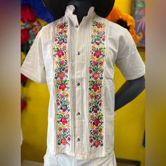 This Shirt Is Gorgeous. Color: Beige Size: Large Material: Manta ,Cotton Please Check Measurements To Make Sure Is The Size You Need. Chest: 24” Waist: 24.5” Sholder:21” Sholder To Hem:28" Note: The Floral Wall Remain The Same But The Embroidery Colors Vary On Each Shirt. Mexican Tunic Traditional Embroidery This Shirt Is Perfect For Any Occasion This Shirt Is Meant To Provide Extreme Comfort Throughout The Day The Perfect Gift Mexican Outfit Men, Mexican Shirts For Men, Classy Womens Dresses, Mens Guayabera Shirts, Mexican Shirts, Mexican Men, Guayabera Shirt, Mexican Embroidery, Mexican Fashion