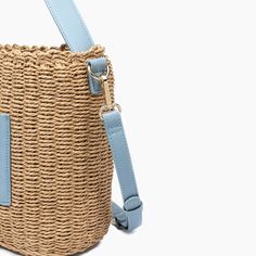 Embrace the sweetness of the season with this adorable mini tote bucket bag composed of woven straw. Featuring luxurious vegan leather detailing to bring both style and durability to your beach or picnic outfits. 100% Vegan Leather, 100% Straw 12''W x 9.5''H x 6''D 23'' adjustable/ removable Strap 7" Top Handle Magnetic Snap Closure 1 inner zipper pocket, 2 inner slit pockets 19.93 oz Style# U2CG01 Bucket Tote Bag, Bucket Tote, Leather Detailing, Basket Tote, Straw Basket, Bow Bag, Designer Crossbody Bags, Basket Bag, Mini Tote