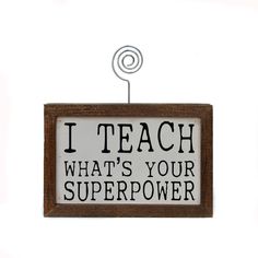 a sign that says, i teach what's your super power? on it