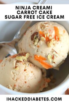 two scoops of ice cream in a white bowl with carrots and nuts on top