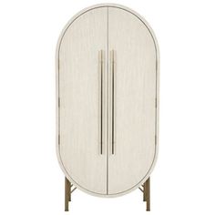 an oval cabinet with two doors and three legs, in white woodgrained finish