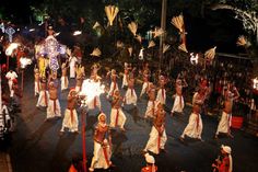 a group of people that are standing in the street with some lights on their heads