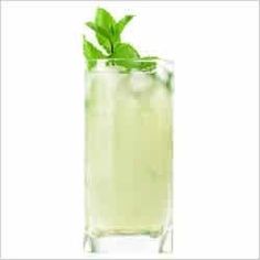 a tall glass filled with lemonade and mint garnished with a green leaf