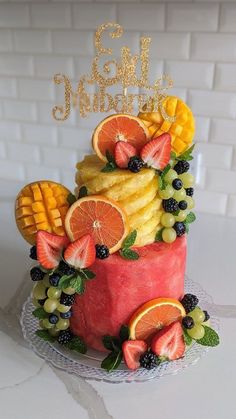 a birthday cake with fruit on top