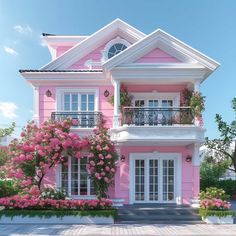 a pink house with white trim and flowers on the front door, windows and balconies