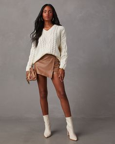 Keep it cute and cozy in the Corey Relaxed Cable Knit Sweater. It features a ribbed V-neckline, hem & cuffs and is made from soft, chunky cable knit fabric. Pair this fall staple with faux leather bottoms or your favorite denim. Relaxed fit V-neckline Long sleeves Ribbed trim Soft, chunky cable knit fabric Runs Large Fall Chunky Knit V-neck Sweater, Cozy Cable Knit V-neck Sweater For Winter, Cozy Knit V-neck Sweater For Fall, Cozy Cable Knit Sweater For Fall, Cozy Cable Knit Fall Sweater, Cozy Long Sleeve Cable Knit V-neck Sweater, Cozy Knitted V-neck Sweater For Fall, Chunky Knit V-neck Sweater For Fall, Cozy Ribbed V-neck Sweater For Winter