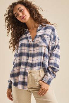 This plaid flannel is an oversized, button-up shirt crafted from soft, cozy material, offering both comfort and a relaxed, stylish look. White Dress Boots, Football Dress, Womens Flannel, Shop Stevie, Football Homecoming, Skirts With Boots, Flannel Women, Altar'd State, Fall Wardrobe