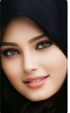 an image of a woman with dark hair and eyeshade wearing a hijab