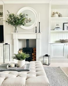 a living room filled with furniture and a fire place