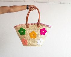 Discover the perfect blend of style and practicality with our Handwoven Straw Bag with Stars Design. Crafted with precision from natural straw and adorned with a charming floral pattern, this stylish tote is ideal for various occasions, from casual outings to market trips. A beautifully crafted bag to accompany you everywhere. Straw Bag with Flowers Design - Shopping Basket - French Market Basket - Handcrafted Moroccan Basket Whether you're looking for a chic market tote, a charming everyday bag, or a thoughtful gift, this Straw Bag with Stars Design is a perfect choice! Many of our customers also love using these bags as stylish storage or decorative accents at home. This bag is sturdy, durable, and will maintain its shape for years to come. Your bag might get slightly misshapen during sh Embroidered Natural Straw Travel Bag, Pink Beach Bag With Leather Handles, Beach Embroidered Natural Shoulder Bag, Embroidered Bucket Bag For Beach, Multicolor Basket Bag For Spring, Pink Embroidered Beach Bag, Pink Straw Bag With Leather Handles For Beach, Multicolor Straw Bags With Leather Handles, Summer Multicolor Basket Bag