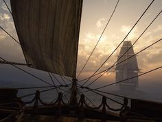 the back end of a sailboat with ropes on it's deck as the sun sets