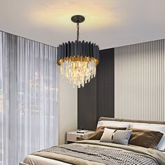 a bedroom with a large bed and a chandelier hanging from the ceiling