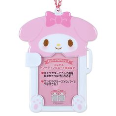 a pink hello kitty cell phone case hanging from a chain