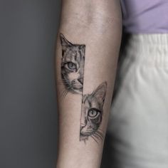 a woman's arm with a cat tattoo on the left side of her arm