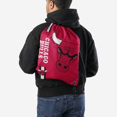 Whether you're going to work, class, or the gym, make sure you always put the team on your back. Literally. Store your stuff and show off your team spirit with this Chicago Bulls Big Logo Drawstring Backpack. Features Easy adjustable cinch top cords to make storing your stuff quick and easy Screen printed design so everyone knows who you're rooting for on gameday Details Dimensions: Approximately 18” x 14” Volume: Approximately 4L Officially licensed Imported Sporty Gym Bag Backpack For Sports, Casual Black Gym Bag With Drawstring, Sporty Drawstring Backpack For Outdoor Activities, Black Drawstring Gym Bag For Sports, Sporty School Backpack With Functional Drawstring, Sports Nylon Gym Bag With Drawstring, Sports Gym Bag In Nylon With Drawstring, Sporty Drawstring Bag For Gym, Sporty Nylon Drawstring Bag For Sports