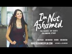 a woman standing in front of a blackboard with the words i'm not abandoned on it