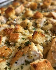 a close up view of a casserole dish with chicken and cheese on it