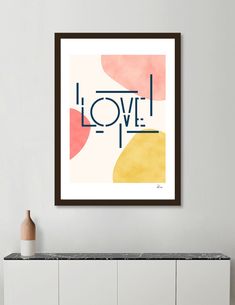 a framed art print with the word love on it