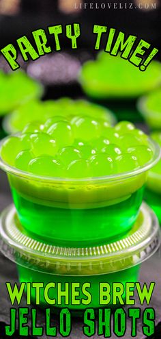 green jello shots sitting on top of each other with the words party time written above them