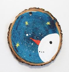 a piece of wood that has been painted with stars and a unicorn face on it