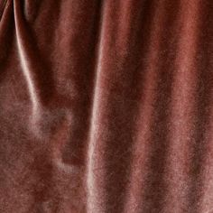 a close up view of a brown velvet fabric