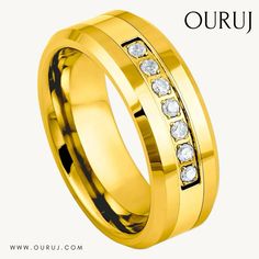 a yellow gold wedding ring with white diamonds on it and the words ouru written in arabic