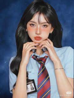 a girl with long black hair wearing a blue shirt and red striped tie, holding her hands to her face