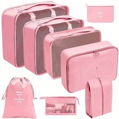 four pieces of pink luggage with matching bags