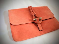 "Fabulous designer purse by Tila March  This is the Romy clutch in burnt orange  Stylish and Elegant - Practical and Fashionable Handbag size: medium Size: 10.5\" x 7.5\" Interior pocket  Made leather/suede Great condition Item will be shipped out within 2 days of purchase. Gift wrapping available upon request. We can also attached a card with a special message on your behalf. Estimated shipping time to Canada and the US is 6-14 business days. Worldwide shipping is available - prices are listed for Canada and USA only but if you wish to have them shipped elsewhere, please message me the shipping address and I will gladly send you a quote. Feel free to contact us if you have any questions.  Thanks for stopping by! Follow us...  Instagram: boutiquevintagebox.bysorina Facebook: Boutique Vinta Orange Clutch Bag For Formal Occasions, Chic Orange Clutch For Everyday Use, Orange Rectangular Clutch For Formal Occasions, Orange Pouch Clutch For Everyday Use, Orange Clutch Bag For Evening, Orange Clutch With Removable Pouch For Travel, Chic Orange Clutch Shoulder Bag, Formal Orange Clutch Bag, Orange Pouch Clutch For Daily Use