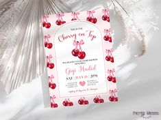 cherries on top birthday party card with pink ribbon and bow, next to snowflakes