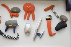 several different items are arranged on a white surface, including scissors and other things to make them look like animals