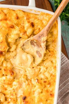 a casserole dish filled with chicken and cheese