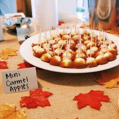 mini caramel apples are arranged on a plate