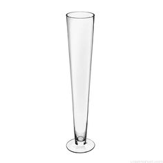 a tall glass vase sitting on top of a table