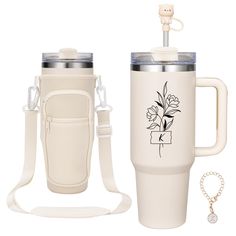 a white coffee cup with a handle and strap next to a travel mug, which has a flower design on the side