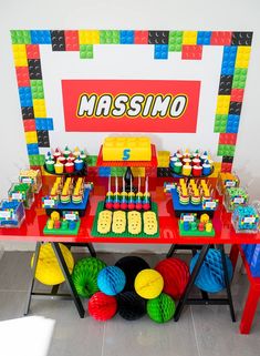 a lego themed birthday party with cake and decorations