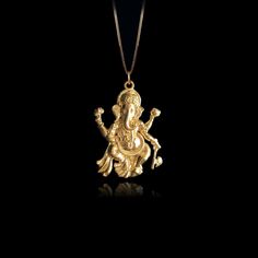 Elevate your faith with our 14k Gold Ganesh Pendant, symbolizing wisdom and prosperity in Hinduism. This solid gold Ganesh necklace captures the essence of the Elephant God. The 14 karat gold Ganesh pendant is more than just jewelry; it's a fine religious symbol that resonates with those seeking a connection to Hindu heritage. Explore our collection of Ganesh-themed jewelry, including elegant gold medallions, also available in 14k yellow gold. PENDANT INFORMATIONThis pendant is made of real, solid gold.• Made in USA• Material: 14k or 18k solid gold• Finish: polished• Height: 1.25" (32 mm) | *includes the small circle, bail dimensions not included• Width: 0.9" (22,5 mm)• Pendant weight: approx. 6 grams (14k)• Bail: fits up to 4 mm chains• Solid back, not hollow• A certificate of authenticit Spiritual 22k Yellow Gold Jewelry, Spiritual 22k Yellow Gold Necklaces, Gold Temple Necklace In Sterling Silver As A Gift, Yellow Gold Spiritual Jewelry For Puja, Gold Sterling Silver Temple Necklace Gift, Spiritual Yellow Gold Pendant Temple Necklace, Spiritual Yellow Gold Jewelry For Puja, Spiritual Yellow Gold Temple Necklace For Rituals, Spiritual Silver Necklace