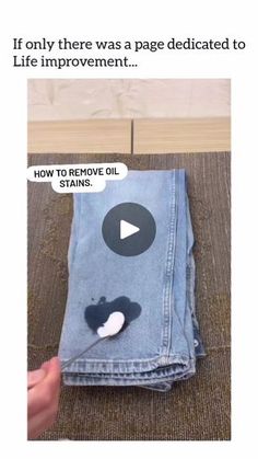 someone is trying to remove oil from an old pair of jean pants that they have been worn